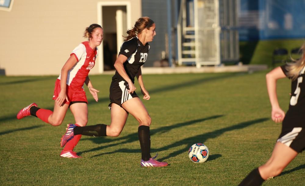 GVL/Kevin Sielaff  
Gabriella Mencotti (20) pushes the ball up field. The Laker soccer team defeats SVSU Sept. 22 by a margin of 6-1 in Allendale.  