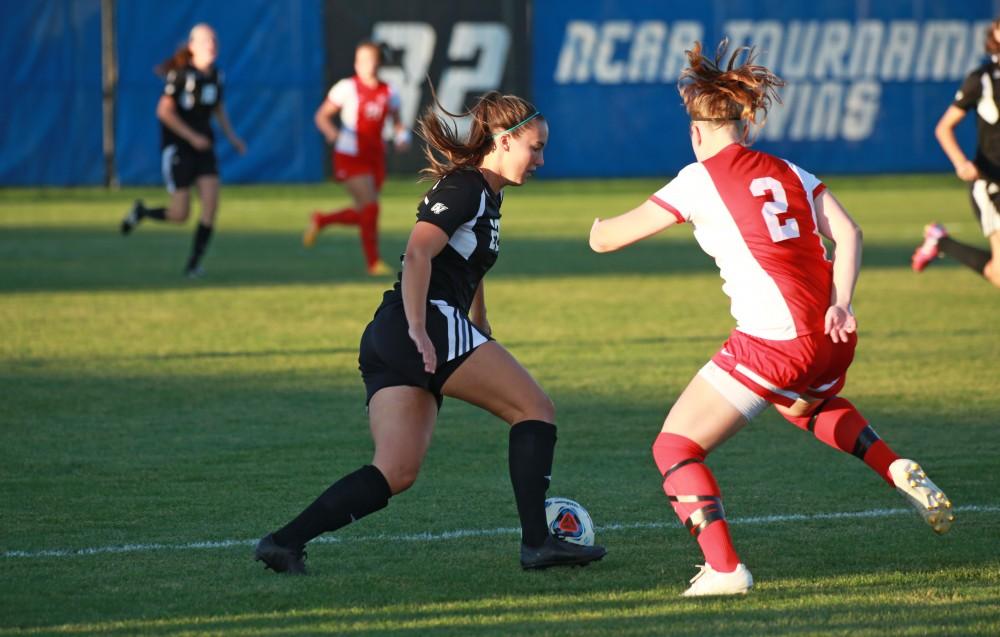 GVL/Kevin Sielaff  
Samantha Riga (22) passes the ball out to center field. The Laker soccer team defeats SVSU Sept. 22 by a margin of 6-1 in Allendale.  