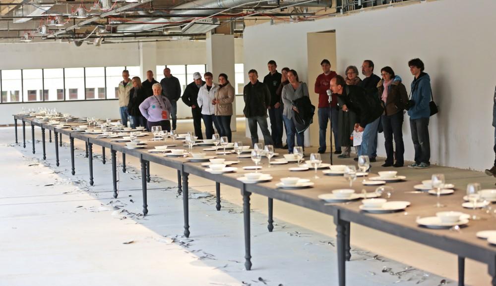 GVL / Kevin Sielaff  
"Whisper," a piece among the top 20 at ArtPrize, involves crowd interaction. Certain vocal intenations trigger vibrations within the tables which allow glasses and plates to drop and shatter. Grand Rapids' annual ArtPrize is held from Sept. 23 - Oct. 1 at various locations around the city. 