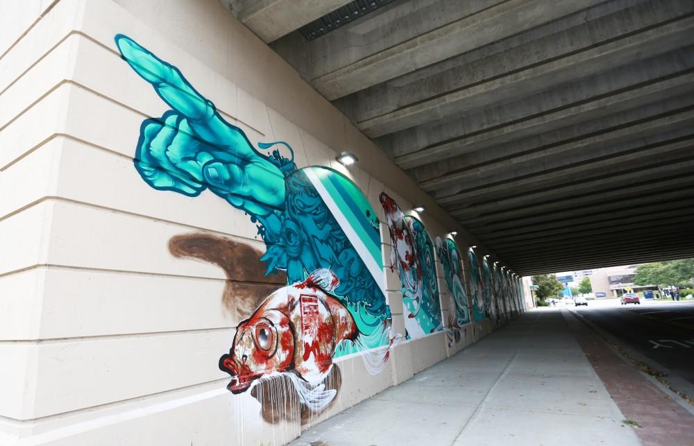 GVL / Kevin Sielaff  
Ruben Ubiera's "In Our Element" is displayed behind the DeVos Center in downtown Grand Rapids.  Grand Rapids' annual ArtPrize is held from Sept. 23 - Oct. 1 at various locations around the city. 