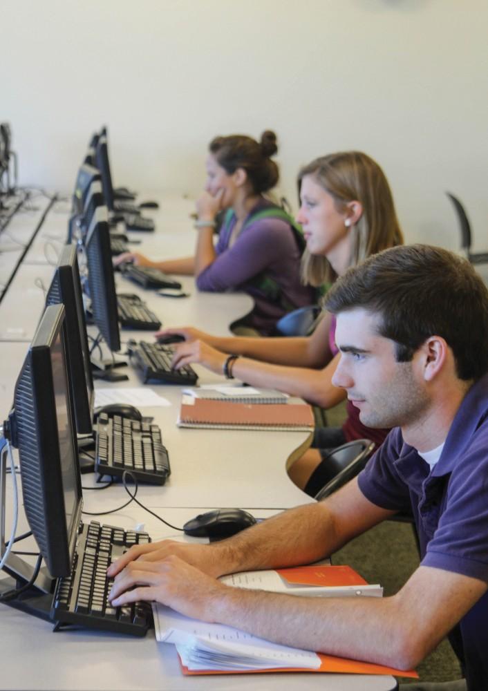 GVL / Archive   
Adam Terwilliger, Rachel Gregg and Melanie Reed work in the Niemeyer computer lab.