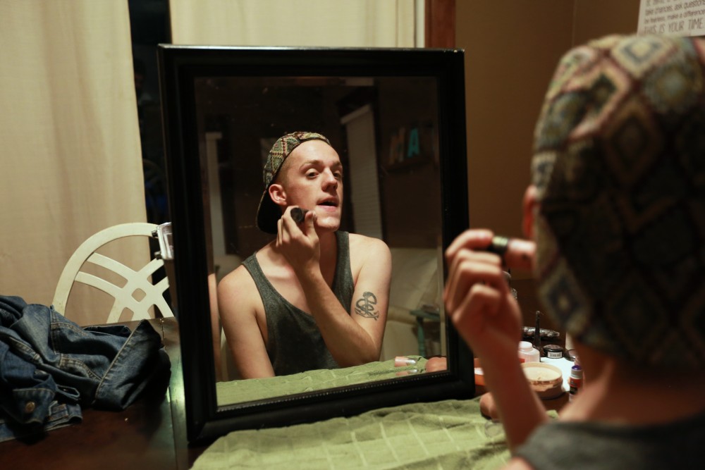 GVL / Kevin Sielaff - Drag Queen Ginger Ambrosia, otherwise known as Nathan Bentley, prepares to perform at Rumors Nightclub in Grand Rapids on Oct. 7.