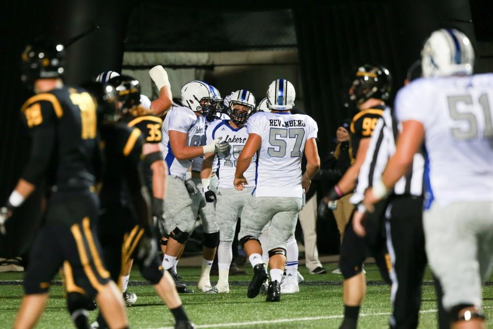 GVL / Kevin Sielaff - Jamie Potts (15) celebrates a touchdown. Grand Valley squares off against Michigan Tech Oct. 17 at Lubbers Stadium in Allendale. The Lakers defeated the Huskies with a score of 38-21.