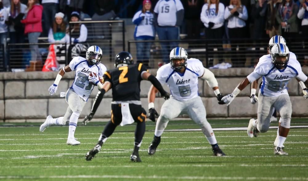 GVL / Kevin Sielaff -  Kirk Spencer (27) runs with the ball on a punt return. Grand Valley squares off against Michigan Tech Oct. 17 at Lubbers Stadium in Allendale. The Lakers defeated the Huskies with a score of 38-21.