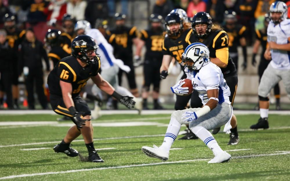 GVL / Kevin Sielaff -  Kirk Spencer (27) stops on a dime to avoid a tackle. Grand Valley squares off against Michigan Tech Oct. 17 at Lubbers Stadium in Allendale. The Lakers defeated the Huskies with a score of 38-21.