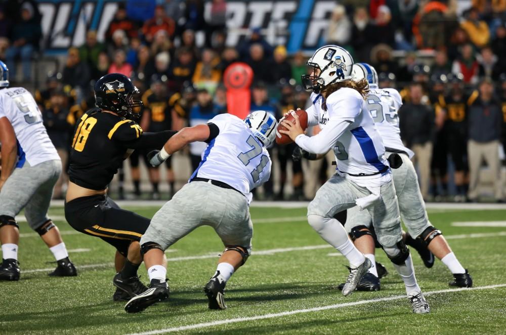 GVL / Kevin Sielaff -  Bart Williams (6) steps back to throw the ball. Grand Valley squares off against Michigan Tech Oct. 17 at Lubbers Stadium in Allendale. The Lakers defeated the Huskies with a score of 38-21.