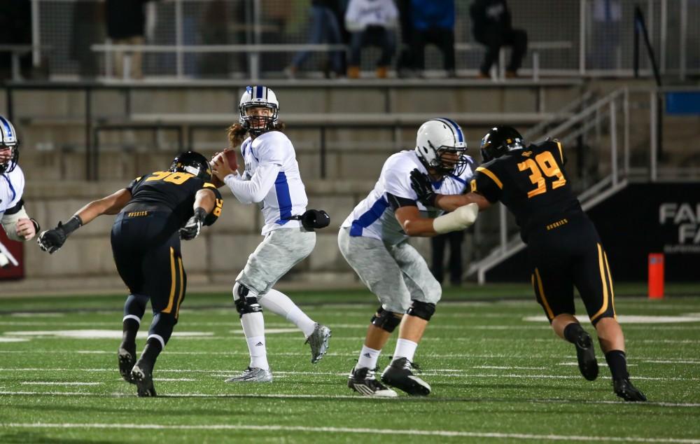 GVL / Kevin Sielaff -  Bart Williams (6) steps back to throw the ball. Grand Valley squares off against Michigan Tech Oct. 17 at Lubbers Stadium in Allendale. The Lakers defeated the Huskies with a score of 38-21.