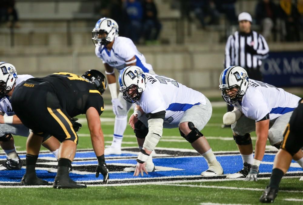 GVL / Kevin Sielaff -  Jim Walsh (78) sets himself on the scrimmage line. Grand Valley squares off against Michigan Tech Oct. 17 at Lubbers Stadium in Allendale. The Lakers defeated the Huskies with a score of 38-21.