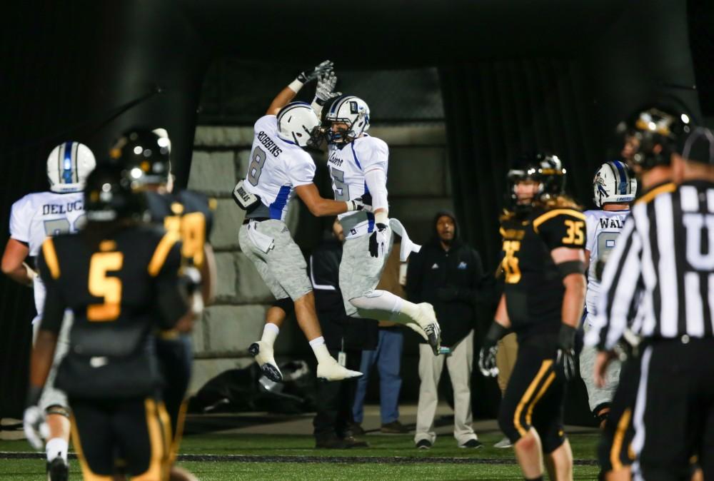 GVL / Kevin Sielaff -  Jamie Potts (15) and Joe Robbins (8) celebrate a touchdown. Grand Valley squares off against Michigan Tech Oct. 17 at Lubbers Stadium in Allendale. The Lakers defeated the Huskies with a score of 38-21.