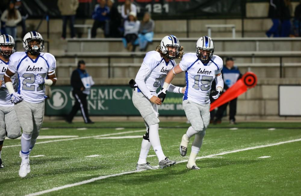 GVL / Kevin Sielaff -  Jamie Potts (15) returns to the Grand Valley bench after a touchdown. Grand Valley squares off against Michigan Tech Oct. 17 at Lubbers Stadium in Allendale. The Lakers defeated the Huskies with a score of 38-21.