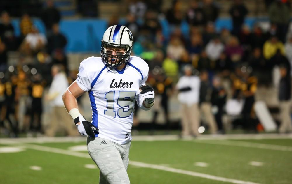 GVL / Kevin Sielaff -  Jamie Potts (15) returns to the Grand Valley bench after a touchdown. Grand Valley squares off against Michigan Tech Oct. 17 at Lubbers Stadium in Allendale. The Lakers defeated the Huskies with a score of 38-21.