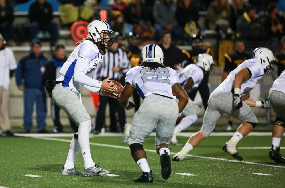 GVL / Kevin Sielaff -  Bart Williams (6) fakes a hand off to Terrell Dorsey (22).  Grand Valley squares off against Michigan Tech Oct. 17 at Lubbers Stadium in Allendale. The Lakers defeated the Huskies with a score of 38-21.