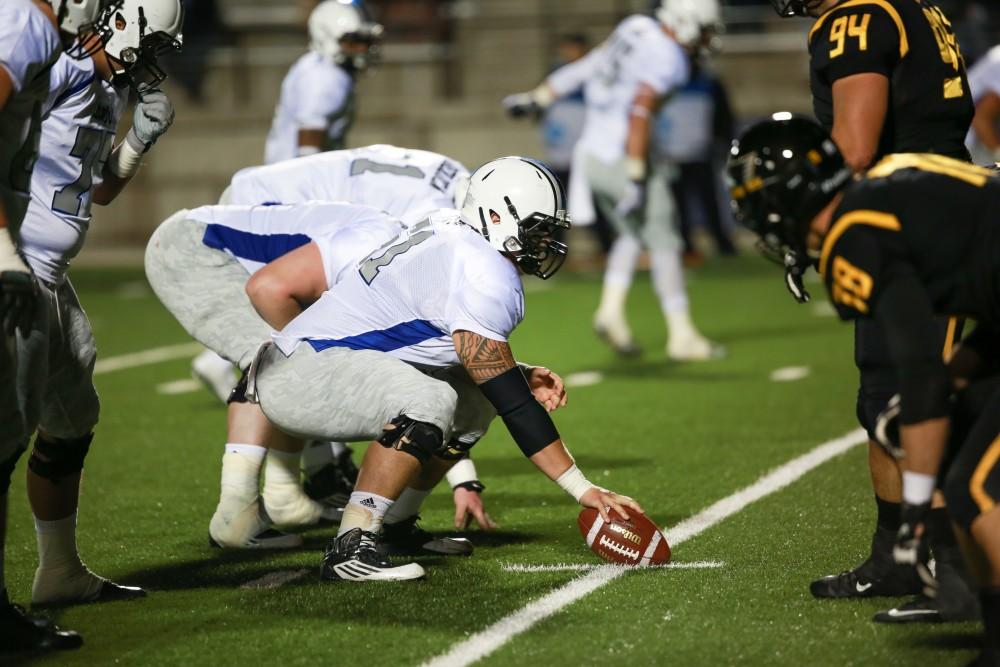 GVL / Kevin Sielaff -  Aaron Cox (51) hikes the ball.  Grand Valley squares off against Michigan Tech Oct. 17 at Lubbers Stadium in Allendale. The Lakers defeated the Huskies with a score of 38-21.