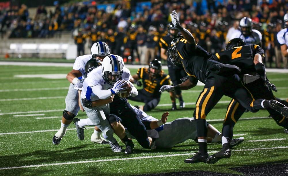 GVL / Kevin Sielaff -  Brandon Bean (3) dives for the end zone and scores a touchdown.  Grand Valley squares off against Michigan Tech Oct. 17 at Lubbers Stadium in Allendale. The Lakers defeated the Huskies with a score of 38-21.