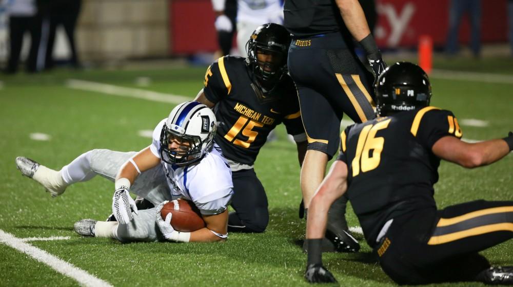 GVL / Kevin Sielaff -  Matt Williams (24) gets off the ground after having received a pass.  Grand Valley squares off against Michigan Tech Oct. 17 at Lubbers Stadium in Allendale. The Lakers defeated the Huskies with a score of 38-21.