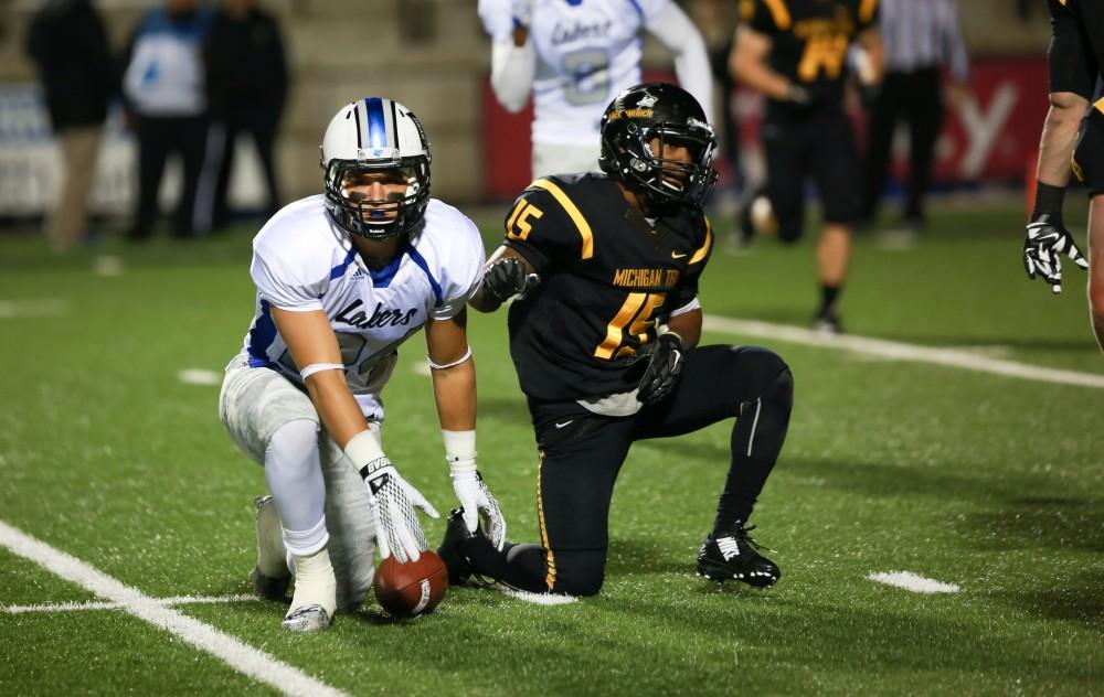 GVL / Kevin Sielaff -  Matt Williams (24) gets off the ground after having received a pass.  Grand Valley squares off against Michigan Tech Oct. 17 at Lubbers Stadium in Allendale. The Lakers defeated the Huskies with a score of 38-21.