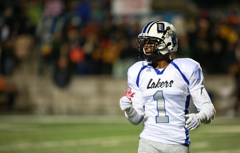 GVL / Kevin Sielaff -  Devin McKissic (1) speaks with Grand Valley's offensive coordinators.  Grand Valley squares off against Michigan Tech Oct. 17 at Lubbers Stadium in Allendale. The Lakers defeated the Huskies with a score of 38-21.