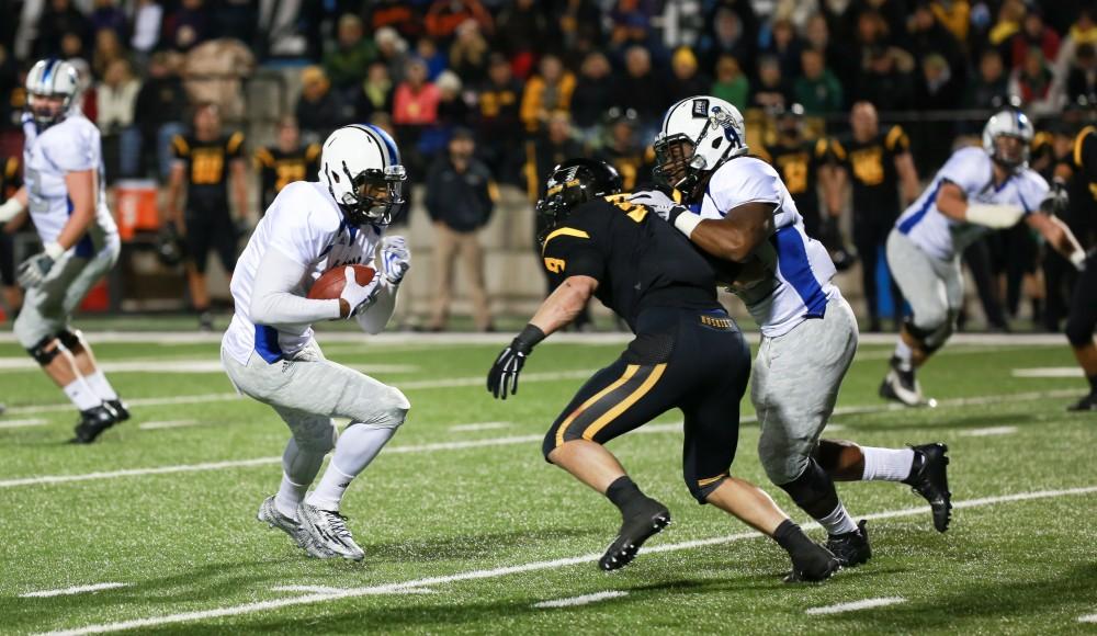 GVL / Kevin Sielaff -  Brandon Bean (3) jukes toward the end zone.  Grand Valley squares off against Michigan Tech Oct. 17 at Lubbers Stadium in Allendale. The Lakers defeated the Huskies with a score of 38-21.