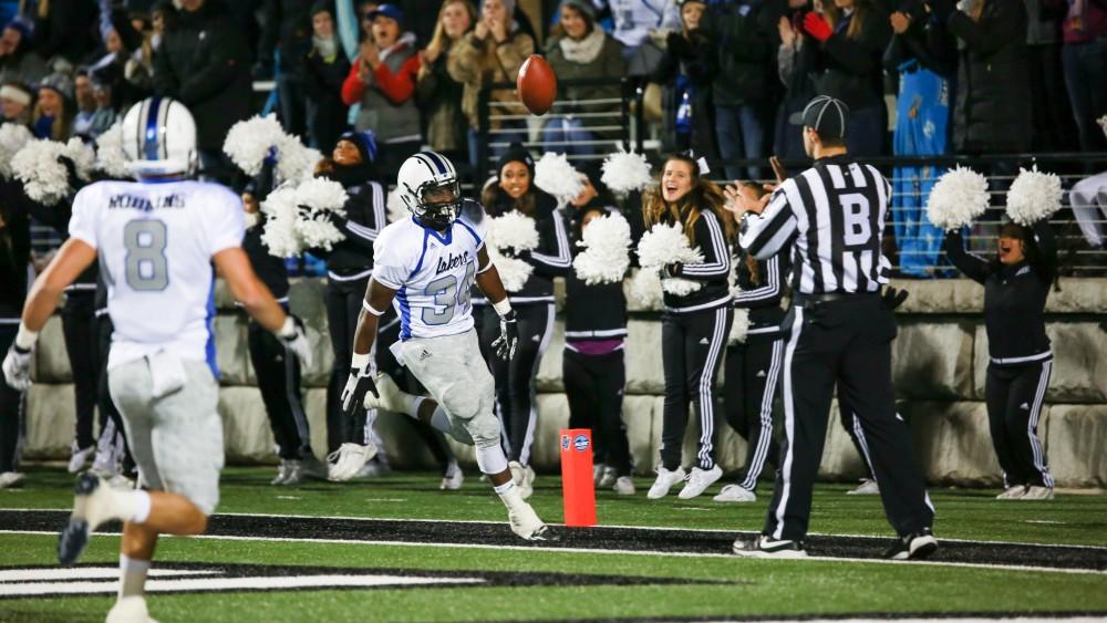 GVL / Kevin Sielaff -  Marty Carter (34) celebrates a touchdown. Grand Valley squares off against Michigan Tech Oct. 17 at Lubbers Stadium in Allendale. The Lakers defeated the Huskies with a score of 38-21.