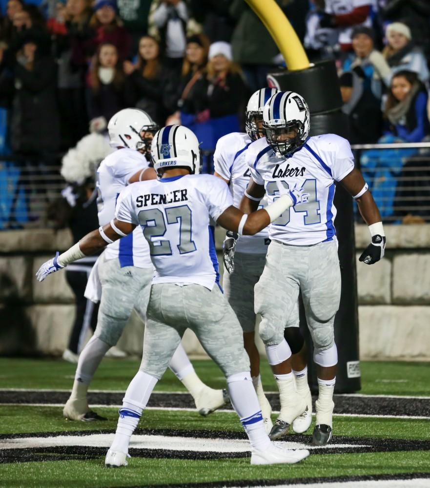 GVL / Kevin Sielaff -  Marty Carter (34) celebrates a touchdown. Grand Valley squares off against Michigan Tech Oct. 17 at Lubbers Stadium in Allendale. The Lakers defeated the Huskies with a score of 38-21.