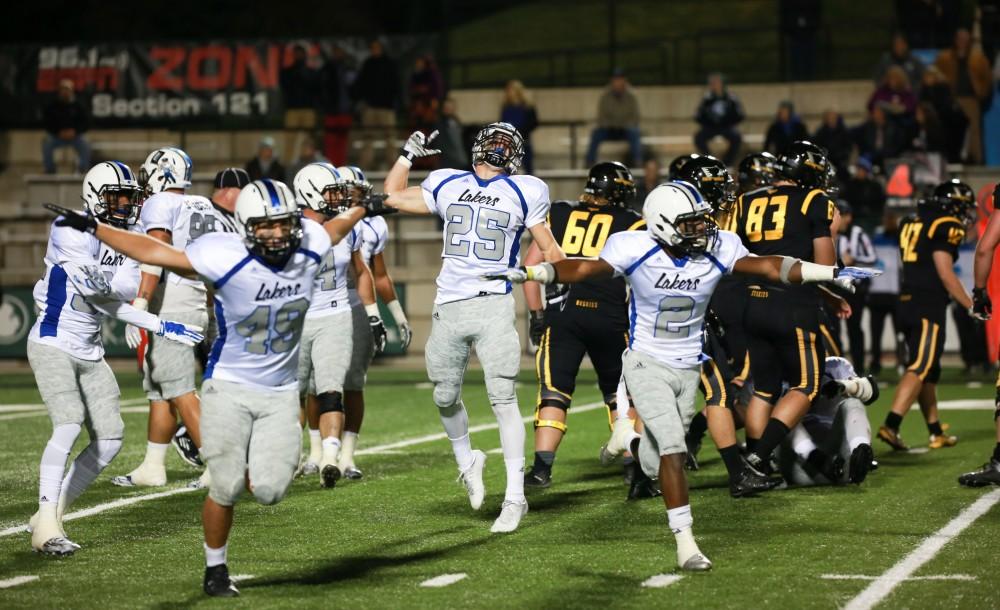 GVL / Kevin Sielaff -  Garrett Pougnet (25) celebrate after an unsuccessful fourth down attempt by Michigan Tech. Grand Valley squares off against Michigan Tech Oct. 17 at Lubbers Stadium in Allendale. The Lakers defeated the Huskies with a score of 38-21.