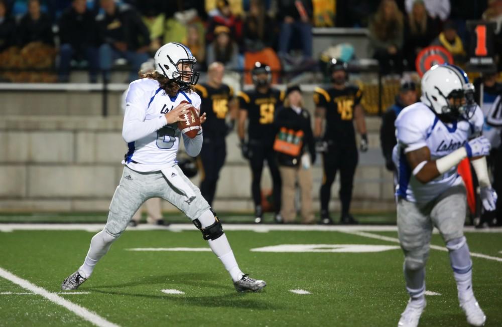 GVL / Kevin Sielaff -  Bart Williams (6) steps back in the pocket and prepares to throw the ball.  Grand Valley squares off against Michigan Tech Oct. 17 at Lubbers Stadium in Allendale. The Lakers defeated the Huskies with a score of 38-21.