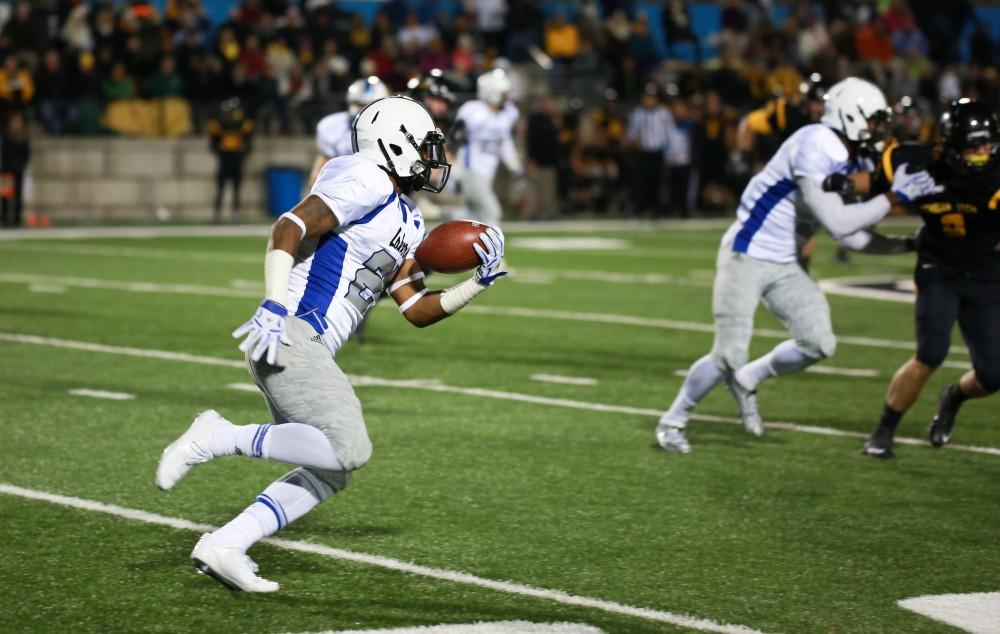 GVL / Kevin Sielaff -  Kirk Spencer (27) sprints the ball down the Huskies end zone.  Grand Valley squares off against Michigan Tech Oct. 17 at Lubbers Stadium in Allendale. The Lakers defeated the Huskies with a score of 38-21.