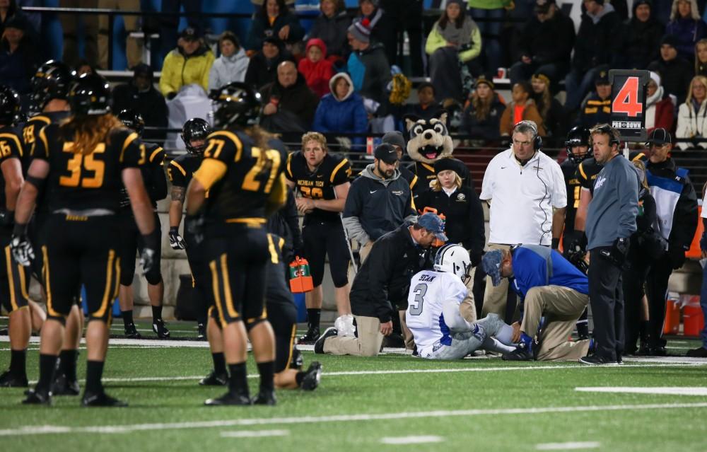 GVL / Kevin Sielaff -  Brandon Bean (3), injured mid-game, is tended to by trainers. Grand Valley squares off against Michigan Tech Oct. 17 at Lubbers Stadium in Allendale. The Lakers defeated the Huskies with a score of 38-21.