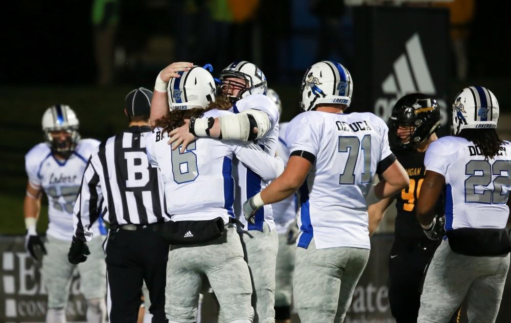 GVL / Kevin Sielaff -  Jim Walsh (78) celebrates after Jamie Potts' touchdown.  Grand Valley squares off against Michigan Tech Oct. 17 at Lubbers Stadium in Allendale. The Lakers defeated the Huskies with a score of 38-21.