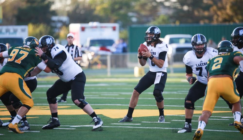 GVL / Kevin Sielaff - Bart Williams (6) steps back in the pocket. Grand Valley squares off against Wayne State University Oct. 11 in Detroit, MI. The Lakers surged to a 38-17 victory vs. the Warriors.