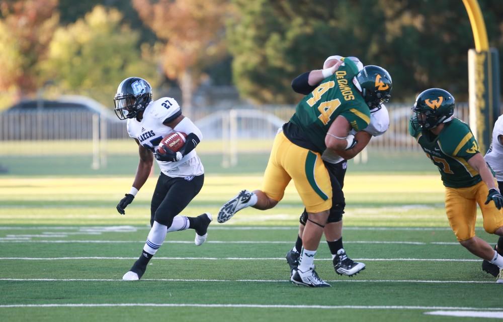 GVL / Kevin Sielaff - Kirk Spencer (27) jukes around the Warrior defense. Grand Valley squares off against Wayne State University Oct. 11 in Detroit, MI. The Lakers surged to a 38-17 victory vs. the Warriors.