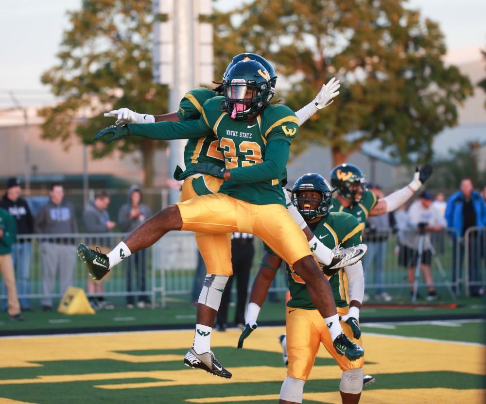 GVL / Kevin Sielaff - After an interception, Wayne State's Lairren Johnson (33) celebrates. Grand Valley squares off against Wayne State University Oct. 11 in Detroit, MI. The Lakers surged to a 38-17 victory vs. the Warriors.