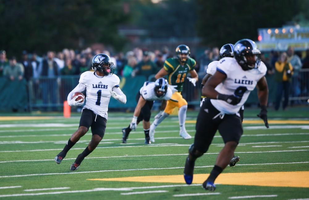 GVL / Kevin Sielaff - Devin McKissic (1) drives a punt return upfield. Grand Valley squares off against Wayne State University Oct. 11 in Detroit, MI. The Lakers surged to a 38-17 victory vs. the Warriors.