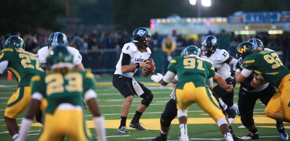 GVL / Kevin Sielaff - Bart Williams (6) scans the field for a receiver. Grand Valley squares off against Wayne State University Oct. 11 in Detroit, MI. The Lakers surged to a 38-17 victory vs. the Warriors.