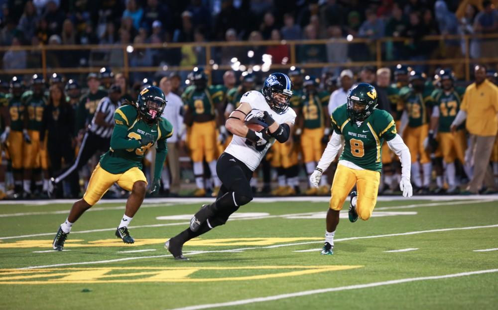 GVL / Kevin Sielaff - Jamie Potts (15) receives a pass and charges toward the endzone. Grand Valley squares off against Wayne State University Oct. 11 in Detroit, MI. The Lakers surged to a 38-17 victory vs. the Warriors.