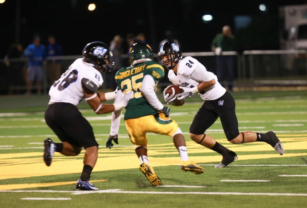 GVL / Kevin Sielaff - Matt Williams (24) runs the ball down field. Grand Valley squares off against Wayne State University Oct. 11 in Detroit, MI. The Lakers surged to a 38-17 victory vs. the Warriors.