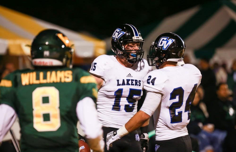 GVL / Kevin Sielaff - Jamie Potts (15) celebrates a touchdown. Grand Valley squares off against Wayne State University Oct. 11 in Detroit, MI. The Lakers surged to a 38-17 victory vs. the Warriors.