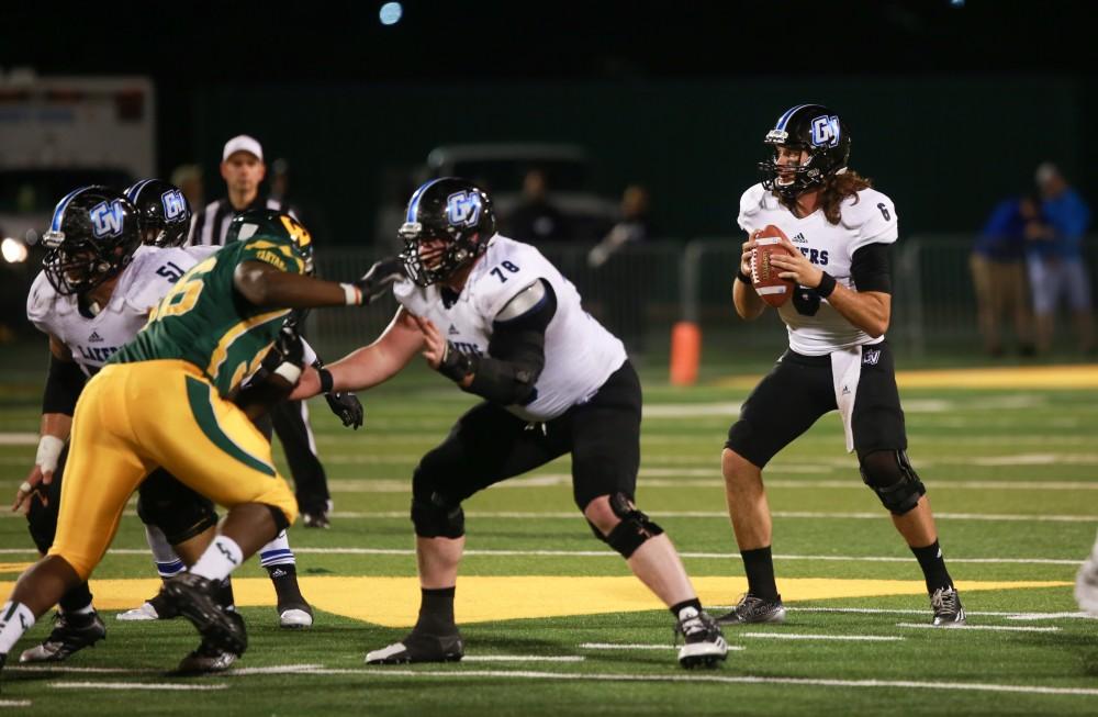 GVL / Kevin Sielaff - Bart Williams (6) looks to throw the ball. Grand Valley squares off against Wayne State University Oct. 11 in Detroit, MI. The Lakers surged to a 38-17 victory vs. the Warriors.