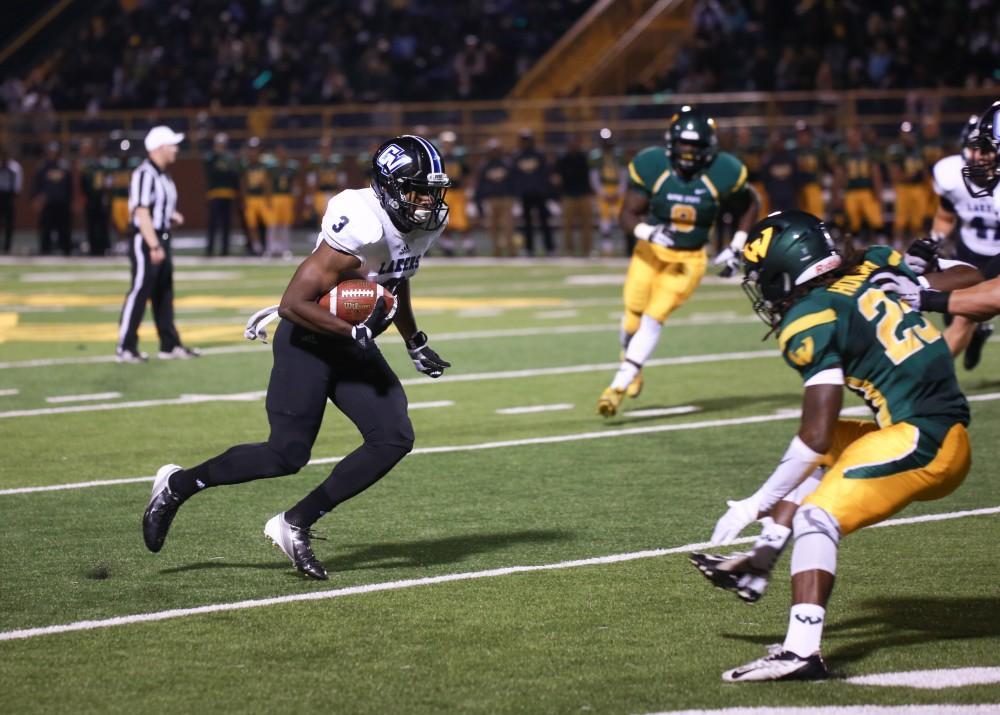 GVL / Kevin Sielaff - Brandon Bean (3) jukes around the Warrior defense for a touchdown. Grand Valley squares off against Wayne State University Oct. 11 in Detroit, MI. The Lakers surged to a 38-17 victory vs. the Warriors.