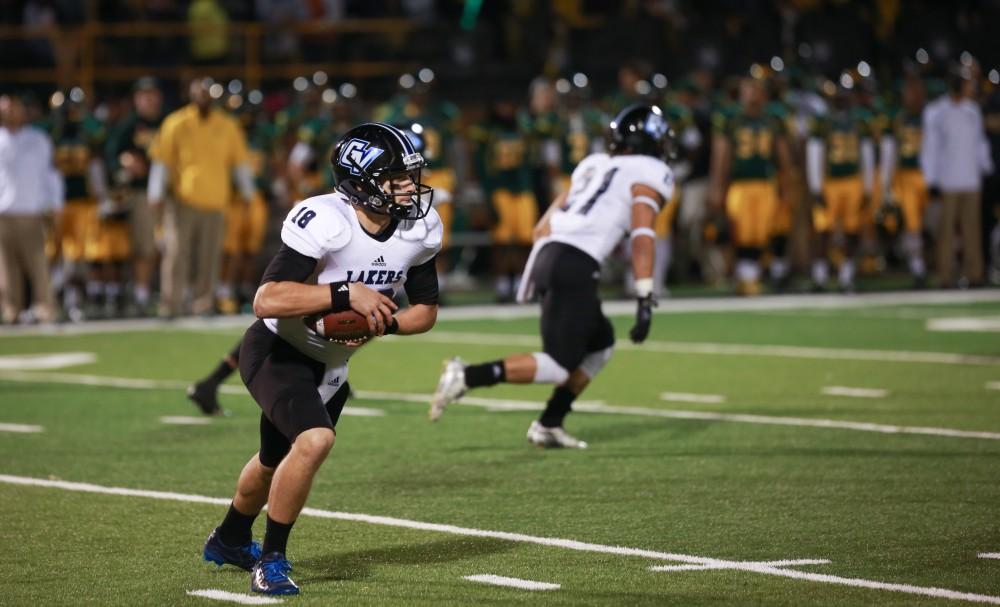 GVL / Kevin Sielaff - Ollie Ajami (18) receives the ball and runs it toward the endzone. Grand Valley squares off against Wayne State University Oct. 11 in Detroit, MI. The Lakers surged to a 38-17 victory vs. the Warriors.