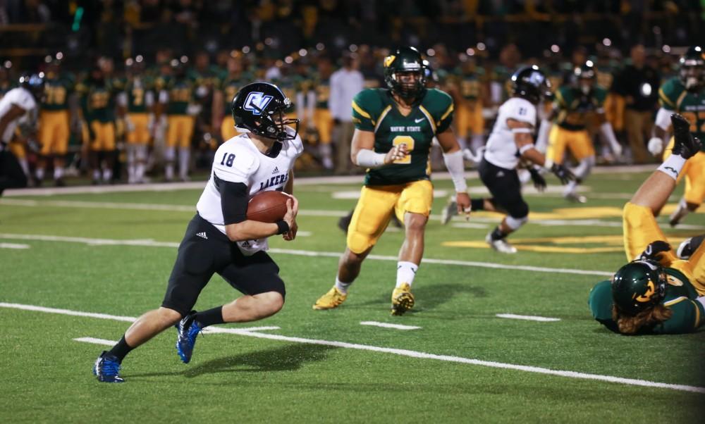 GVL / Kevin Sielaff - Ollie Ajami (18) runs the ball toward the endzone. Grand Valley squares off against Wayne State University Oct. 11 in Detroit, MI. The Lakers surged to a 38-17 victory vs. the Warriors.