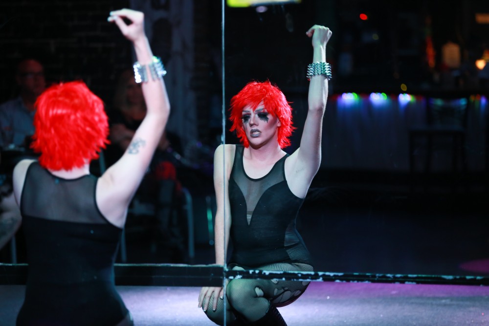 GVL / Kevin Sielaff - Drag Queen Ginger Ambrosia, otherwise known as Nathan Bentley, performs at Rumors Nightclub in Grand Rapids on Oct. 7.