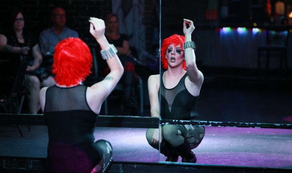 GVL / Kevin Sielaff - Drag Queen Ginger Ambrosia, otherwise known as Nathan Bentley, performs at Rumors Nightclub in Grand Rapids on Oct. 7.