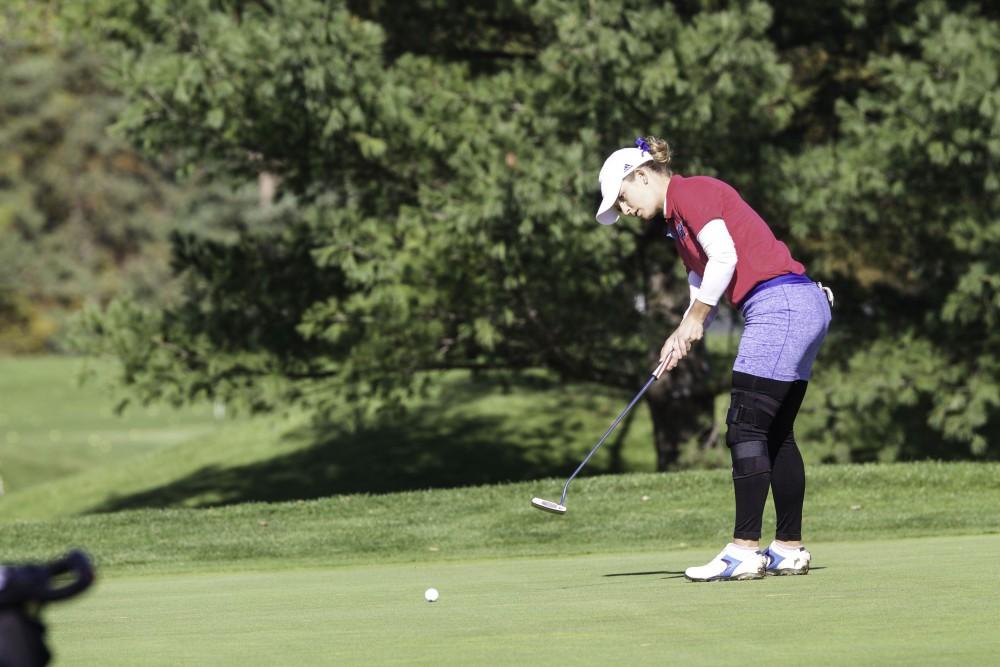 GVL / Sara Carte
Grand Valley Girl’s Golf player, Samantha Moss, puts the ball on hole nine during the Davenport Invitational at the Blythefield Country Club on Oct. 26.