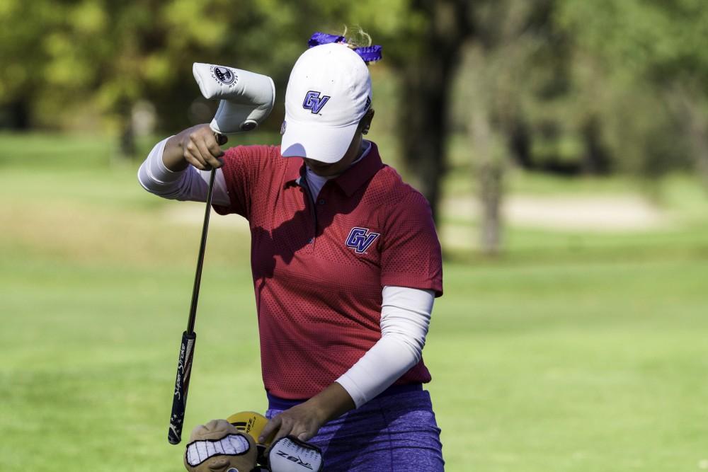 GVL / Sara Carte
Grand Valley Girl’s Golf player, Samantha Moss, puts her club away during the Davenport Invitational at the Blythefield Country Club on Oct. 26.