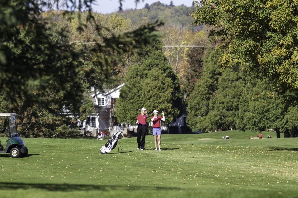 GVL / Sara Carte
Grand Valley Girl’s Golf assistant coach, Megan Ingles (left), coaches player, Danielle Crilley (right), during the Davenport Invitational at the Blythefield Country Club on Oct. 24.