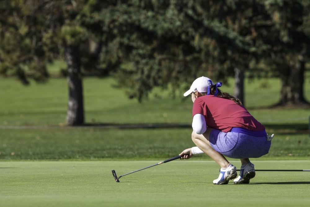 GVL / Sara Carte
Grand Valley Girl’s Golf player, Danielle Crilley, lines up her put during the Davenport Invitational at the Blythefield Country Club on Oct. 26.