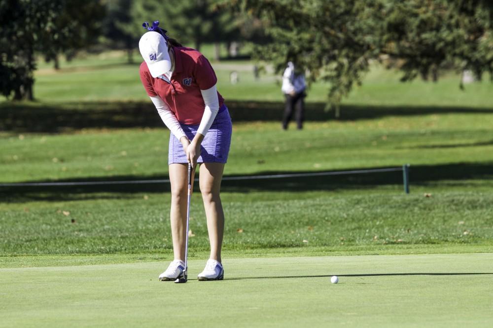 GVL / Sara Carte
Grand Valley Girl’s Golf player, Danielle Crilley, puts the ball on hole nine during the Davenport Invitational at the Blythefield Country Club on Oct. 26.