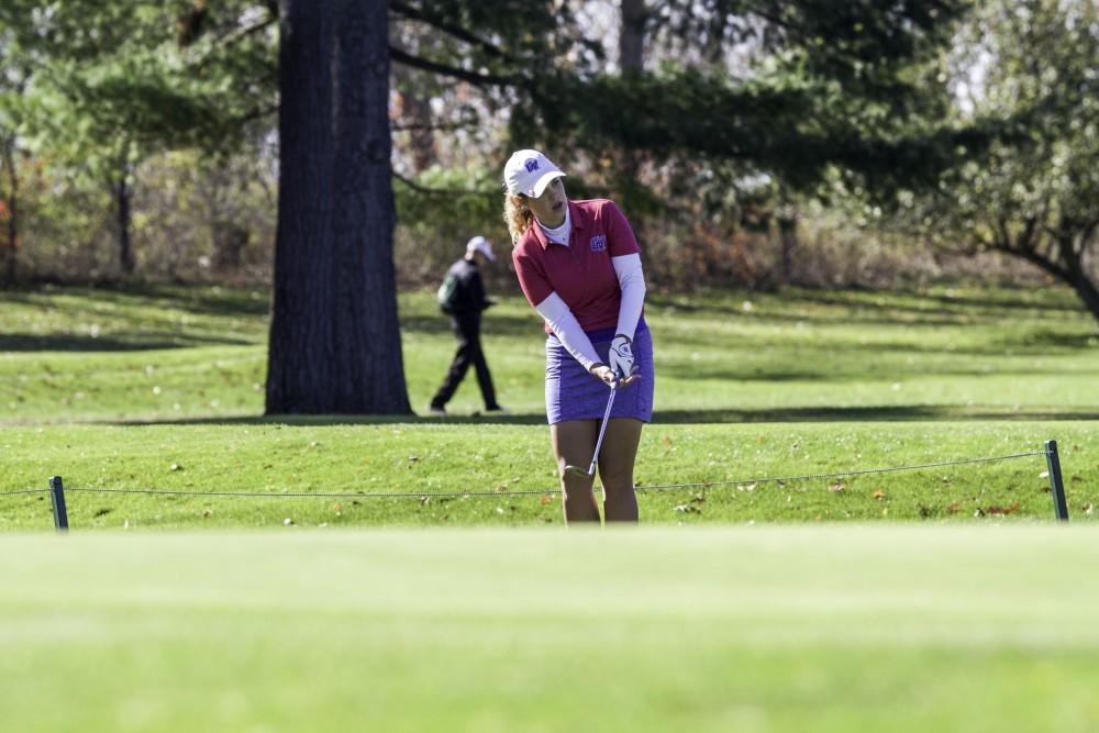 GVL / Sara Carte
Grand Valley Girl’s Golf player, Alex Taylor, chips the ball onto the green during the Davenport Invitational at the Blythefield Country Club on Oct. 26.