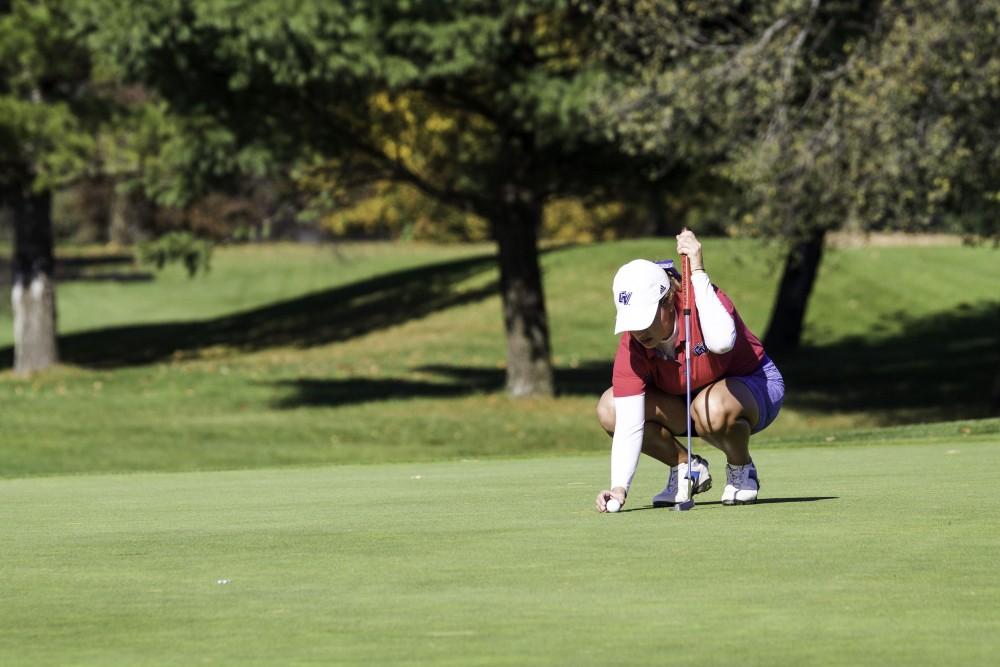 GVL / Sara Carte
Grand Valley Girl’s Golf player, Alex Taylor, line up her put during the Davenport Invitational at the Blythefield Country Club on Oct. 26.